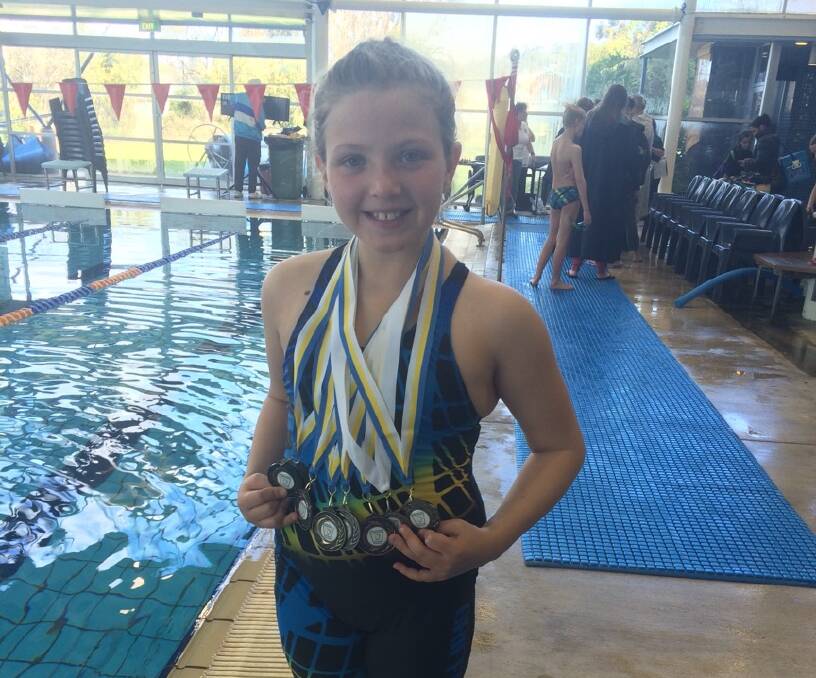 MEDAL HAUL: Mia Jones broke a record in the 50-metre butterfly at Albury.
