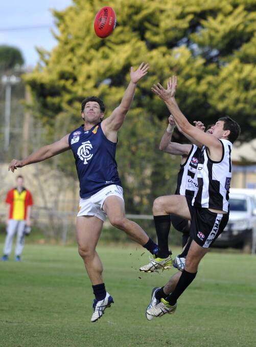 Coleambally veteran Shane Pound, left, in one of his 300-plus first grade games for the Blues.