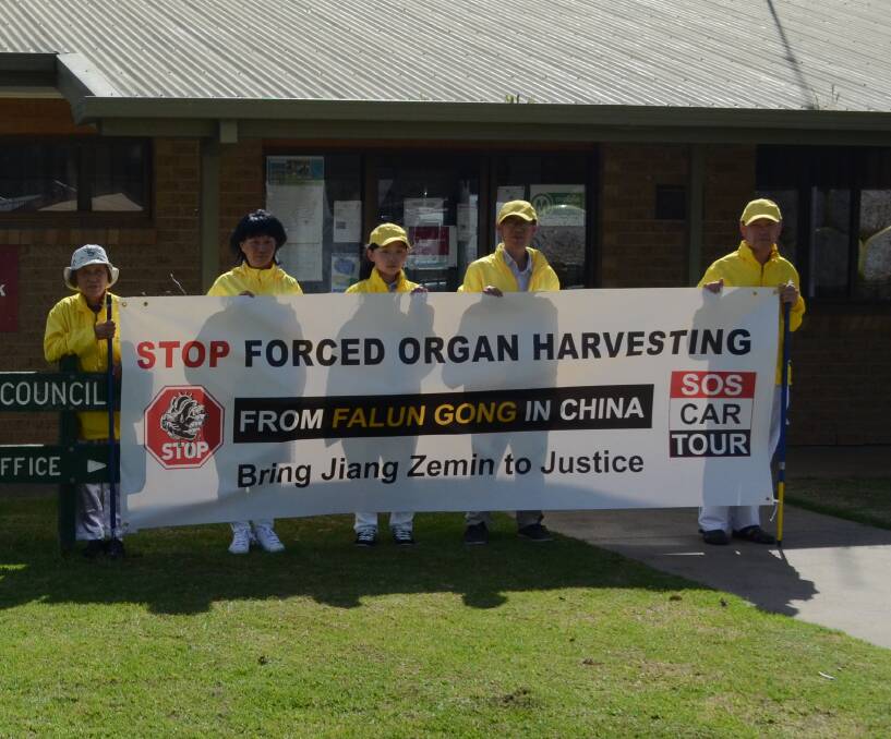 Spreading the message: Members of the Falun Gong were in Darlington Point to spread the message of atrocities that have occurred in China. Picture: Liam Warren