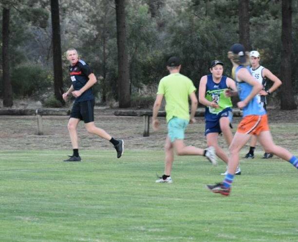 LEADING: Former Essendon defender Dustin Fletcher leads a training session with Coleambally Blues players.