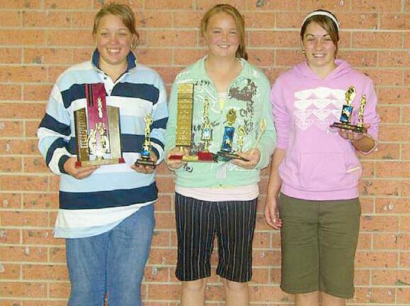 FROM THE PAST: Caitlyn Boschetti, Hannah Carroll and Jessica Noack, with their sporting awards, as pictured in 2006 in The Observer.