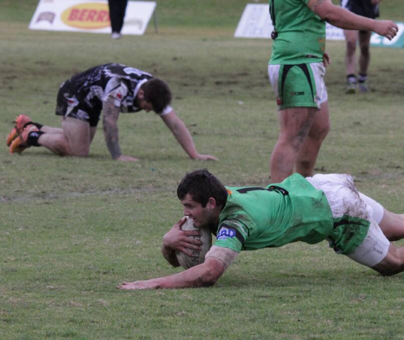 AGONY AND ECSTASY: Leeton's Tristin Johnson scoring one of several tries for the Greens on Sunday. 
Picture: Ron Arel.