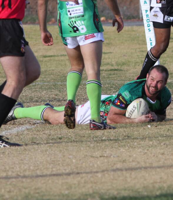 GREENS TAKE DOWN: Coach Brent Pike crosses the line in a recent match at No. 1 Oval. Leeton were able to keep their finals dream alive when they defeated the Roosters on Sunday. Photo: Talia Pattison 
