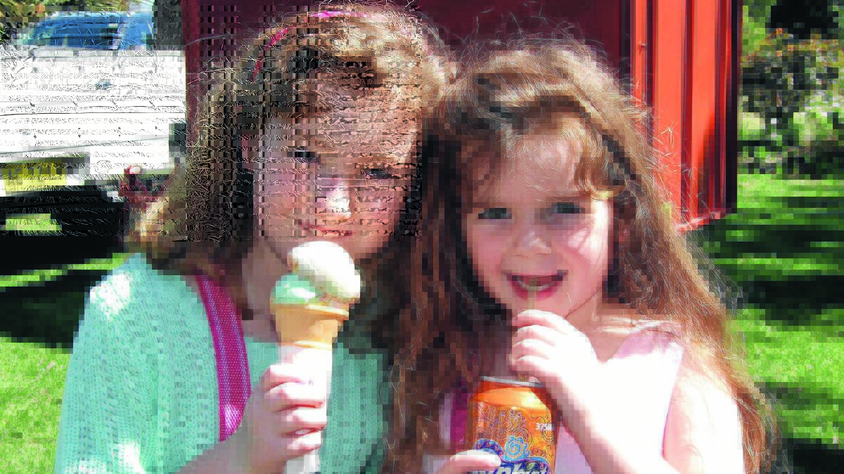 PLANS UNDER WAY: Coleambally’s Olivia Whelan and Piper Demamiel enjoy the festival in 2012. 