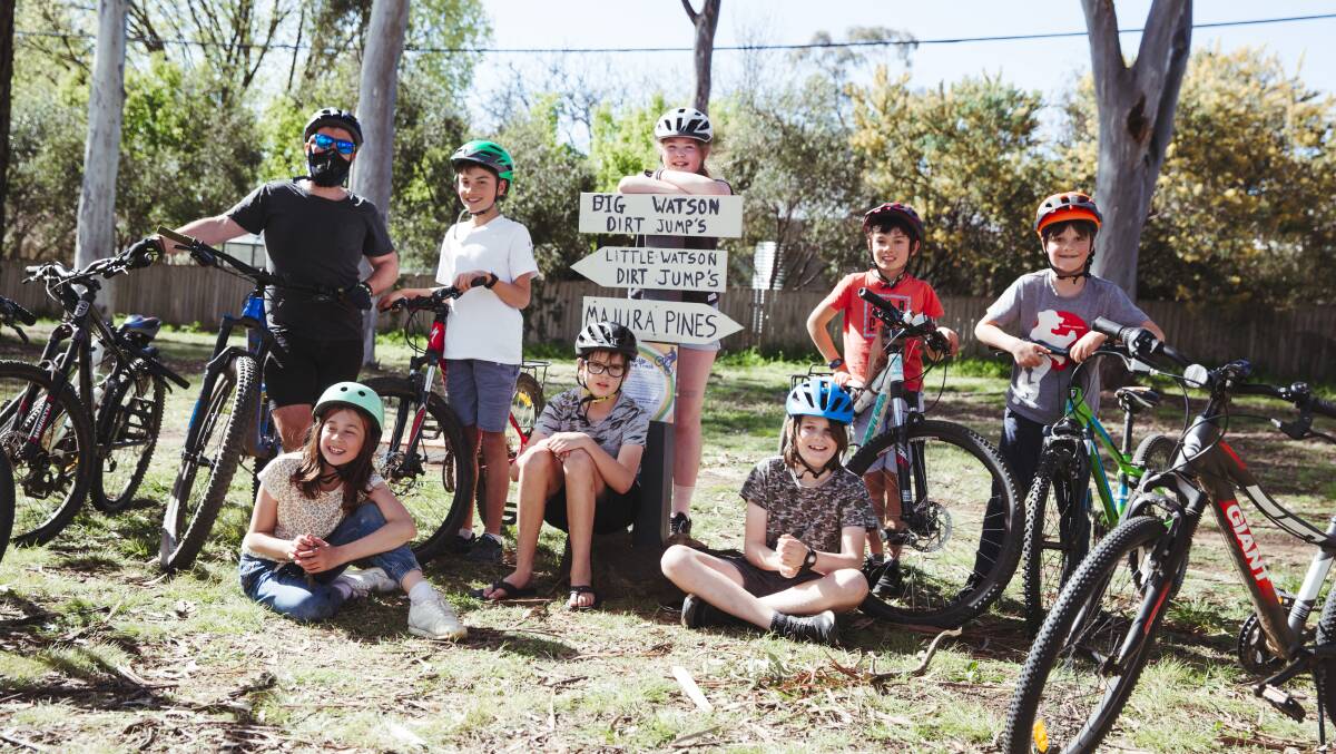 Tom Corra with kids Aiden Isbister,11, Abigail Hardy,10, Toby Isbister, 9, Hugo McDuff, 9, Elsa Gomez, 11, Wilkie Denniss, 11, and Rufus McDuff at the Watson Pop-Up Bike Track they helped build. Picture: Dion Georgopoulos