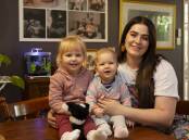 BIGGEST REWARD: Nurse and placenta encapsulation specialist Emily Day at her Wagga home on Mothers' Day with her daughters Laina and Dulcie. Picture: Madeline Begley 