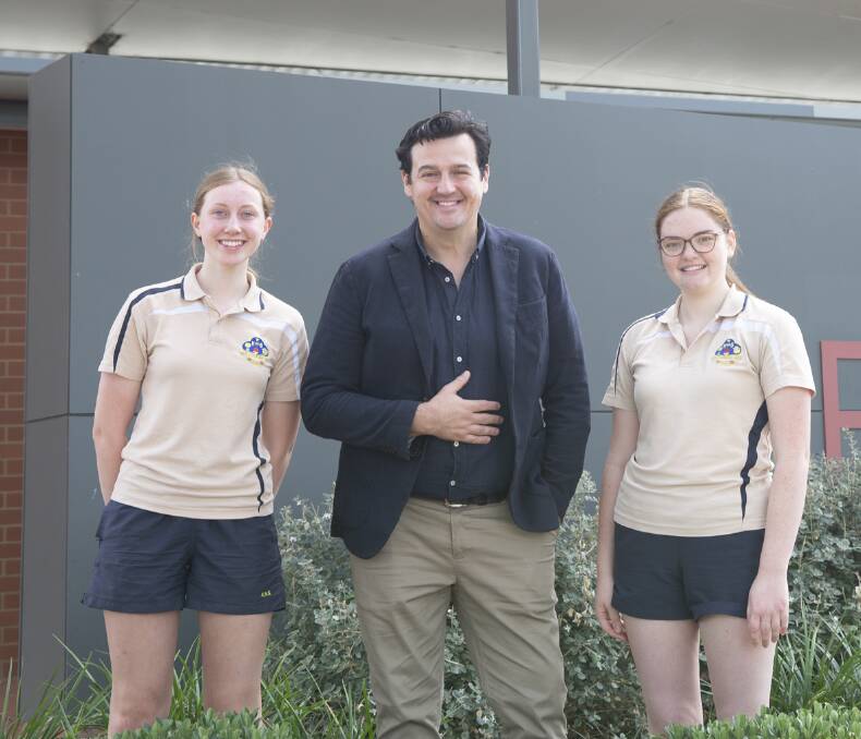 BIG PICTURE: Kooringal High School students Josie Galvin and Juliet Barber with alumnus and former Wiggle Sam Moran. Picture: Madeline Begley