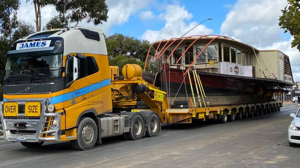HEAVY LOAD: Residents of Hay captured the moments the historic vessel was transported through their town. Picture: Amy Young