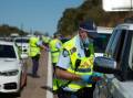 FINES ISSUED: Police stopping drivers on the a NSW Highway, Revenue NSW says only around 18 per cent of public health order fines have been paid. PHOTO: Marina Neil