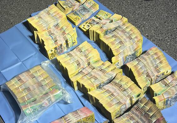 Police seized almost $1 million in cash on a major Wagga road and arrested a man over the largest single seizure of pharmaceutical drugs in the state's history. Pictures by NSW Police