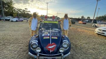 Nathan Leversha and Trevor Wagon from Victoria pictured with their Volkswagon Beatle at the Darlington Point Rec Ground Pictures by Allan Wilson