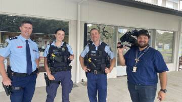 Murrumbidgee Police District Inspector Glenn Smith with Constables Grace Lee and Jordan Lee with NSW Police media cameraman Ethan Borle in Coleambally on March 18. Picture by Allan Wilson