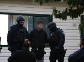 A 19-year-old is arrested in Doonside under Strike Force Dribs which is investigating the Wakeley riot. Picture supplied by NSW Police Force