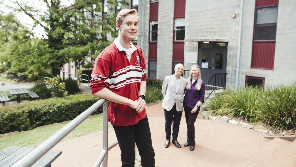 Stuart Kennedy, pictured with parents Neil and Anne, graduated from year 12 at Canberra Grammar School in 2021 where he was a boarding student. Picture: Dion Georgopoulos