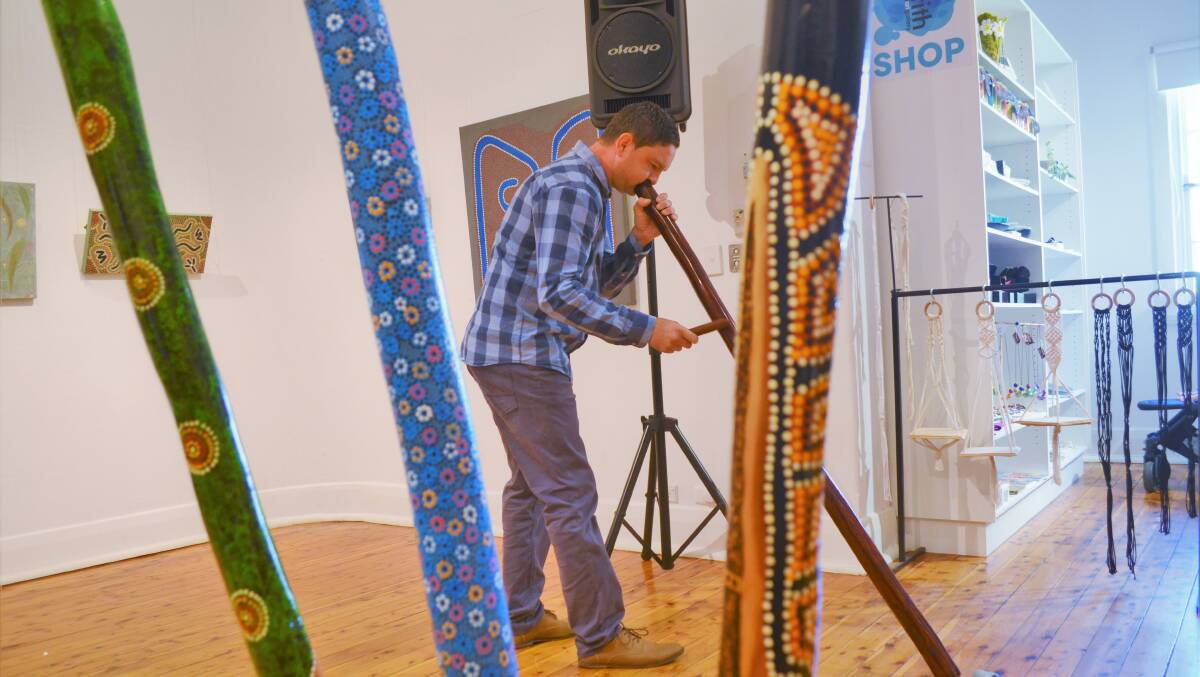 MUSICAL TALENT: Ben Curphey performs a didgeridoo solo at the opening day of the Murru exhibition on Wednesday. Picture: Kenji Sato