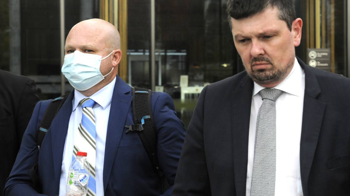 Mark Wallis, left, outside court with solicitor Michael Kukulies-Smith. Picture: Blake Foden