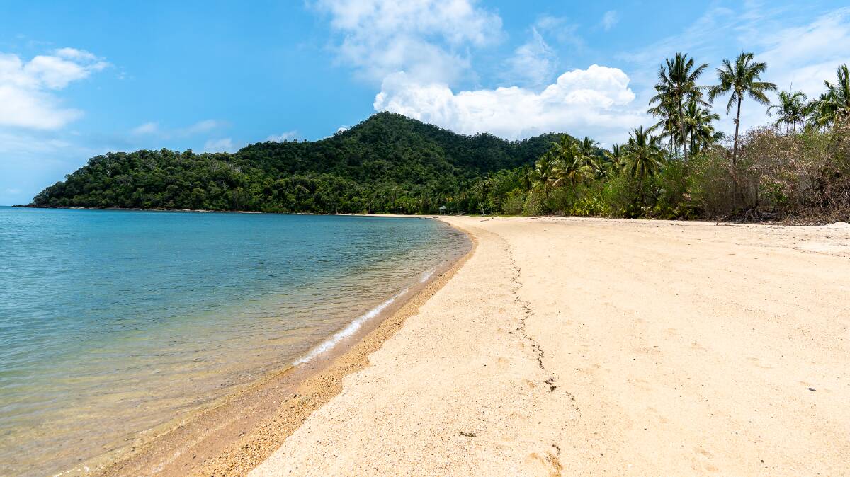 The main beach on Dunk Island where the resort once was