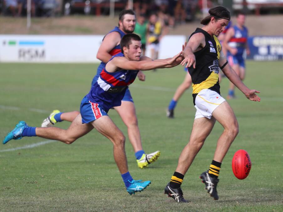 SEASON OPENER: Wagga Tigers' Reid Gordon gets his kick away against Turvey Park in the Good Friday game this year. Next year's Good Friday game will open the Riverina League season. Picture: Les Smith