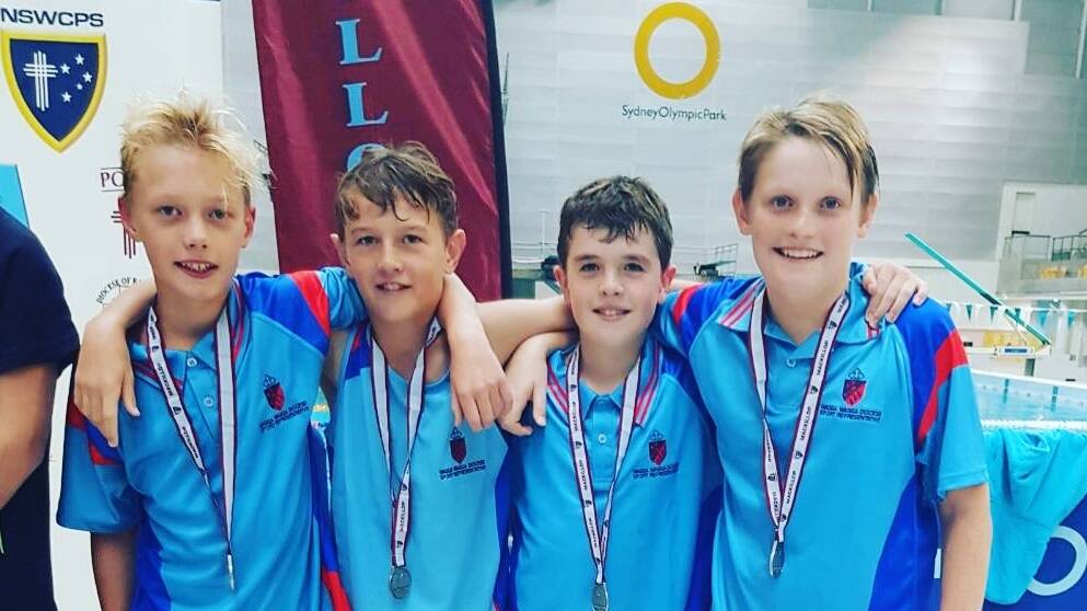Swim Stars: Saint Peter's Primary School students Riley Perkins, Dallas Hickey, John Star, Logan Goudie, pose after winning silver during the NSWCCP. PHOTO: Contributed 