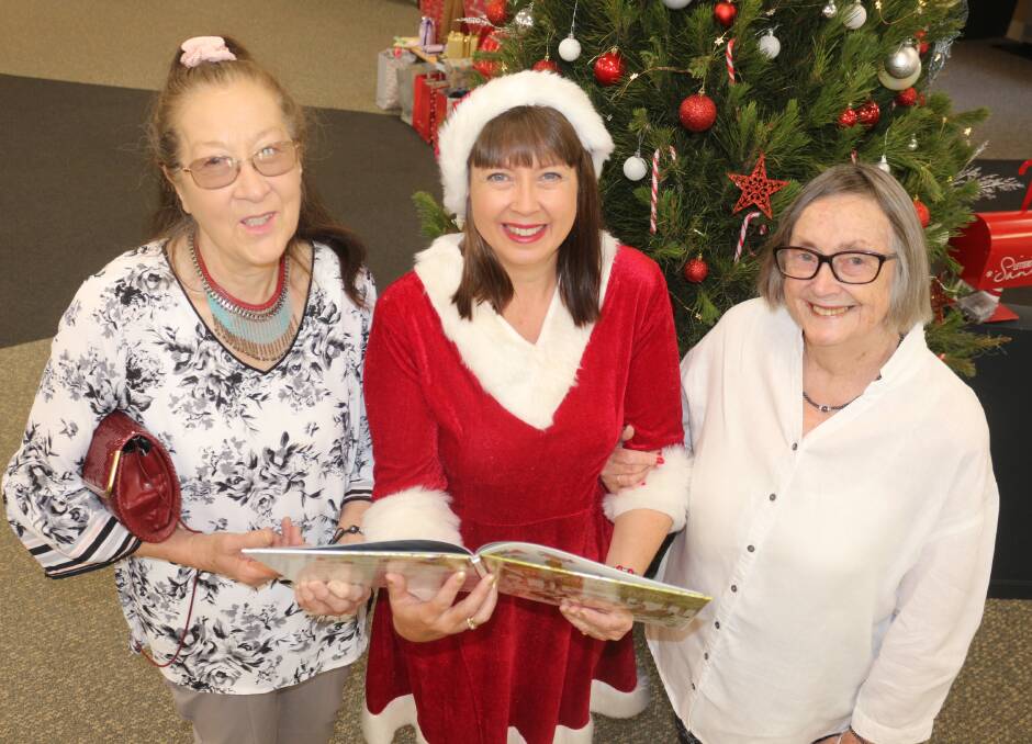DEDICATION: Sue Denson, Caroline Touhey and Marjorie Webb at the Christmas book reading of Ms Toughey's fourth book 'The Christmas Garden'. PHOTO: Jacinta Dickins