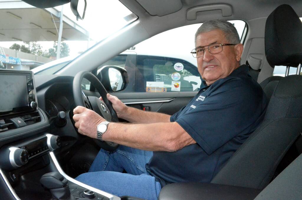 LET'S RIDE: John Santos behind the wheel of the car provided by the Cancer Council to help transport patients to their appointments.