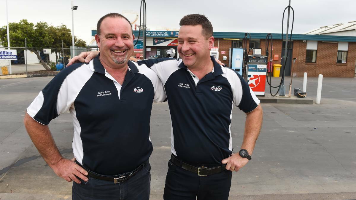 The now beaming Rodney Smith (left) with his equally chuffed workmate Drew May. Picture: Mark Jesser