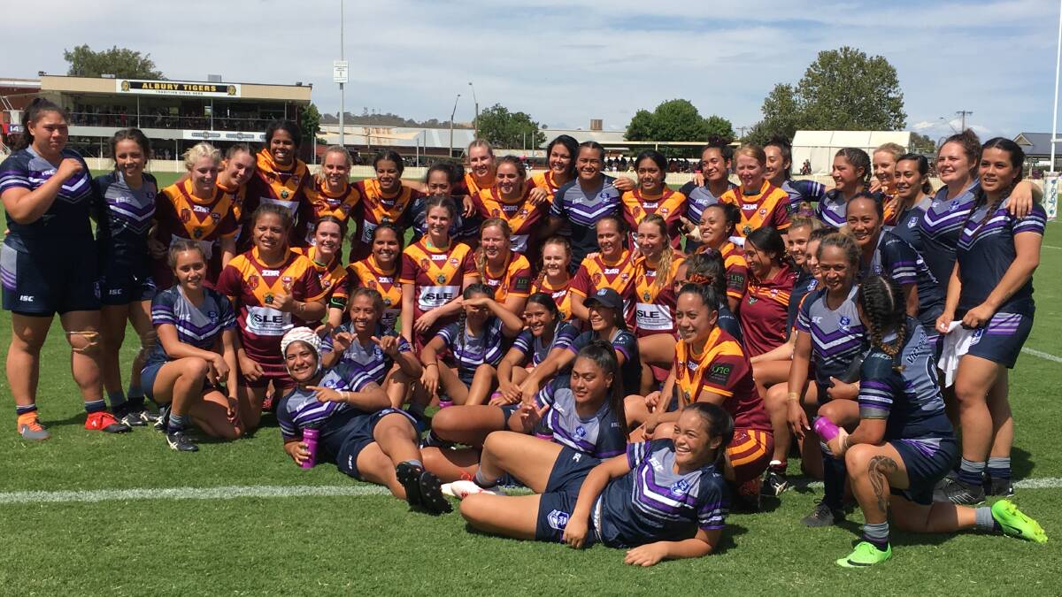 STRONG SPIRIT: Riverina and Victoria's women's teams after their game at Albury on Saturday.