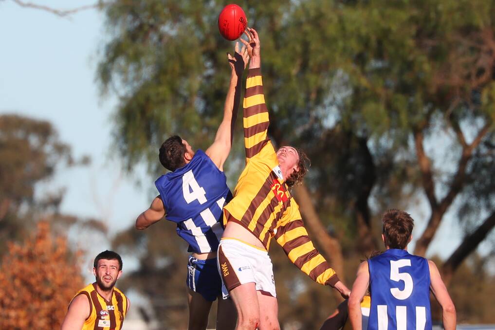 JOSTLING FOR POSITION: Temora ruckman Chris Stacey and East Wagga-Kooringal's Kyle North-Flanagan do battle in round nine when the Roos had their first win over a top-three team and knocked the Hawks from top spot. Picture: Emma Hillier