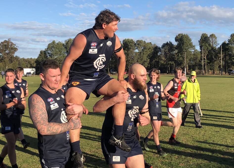 ACHIEVEMENT: Coleambally's Shane Pound is chaired off after his 333rd first grade game for the Blues. 
