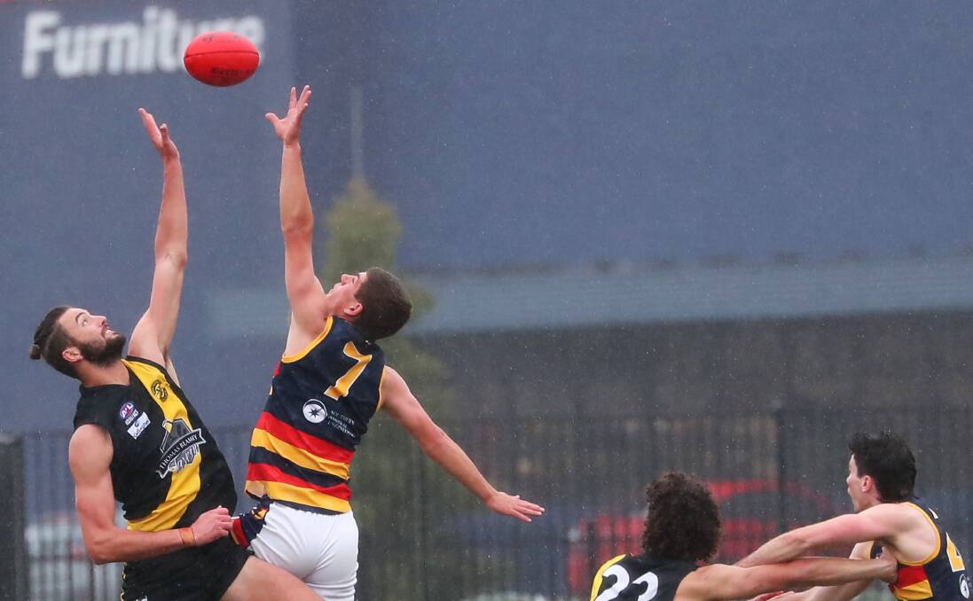 Kyle Pete competes with Tigers' Brad Graham in the 2020 AFL Riverina Championship finals.