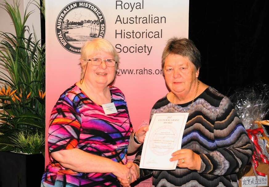 CEF CDP chairperson Penny Sheppard being presented by RAHS President Associate Professor Carol Listen AO with an award certificate at recent Royal Historical Society of Australia conference in Cowra