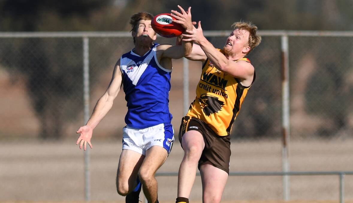 TOUGH CONTEST: Farrer's Tom Groves battles for possession with Hume's Michael Collins during their enthralling representative clash. PHOTO: The Daily Advertiser