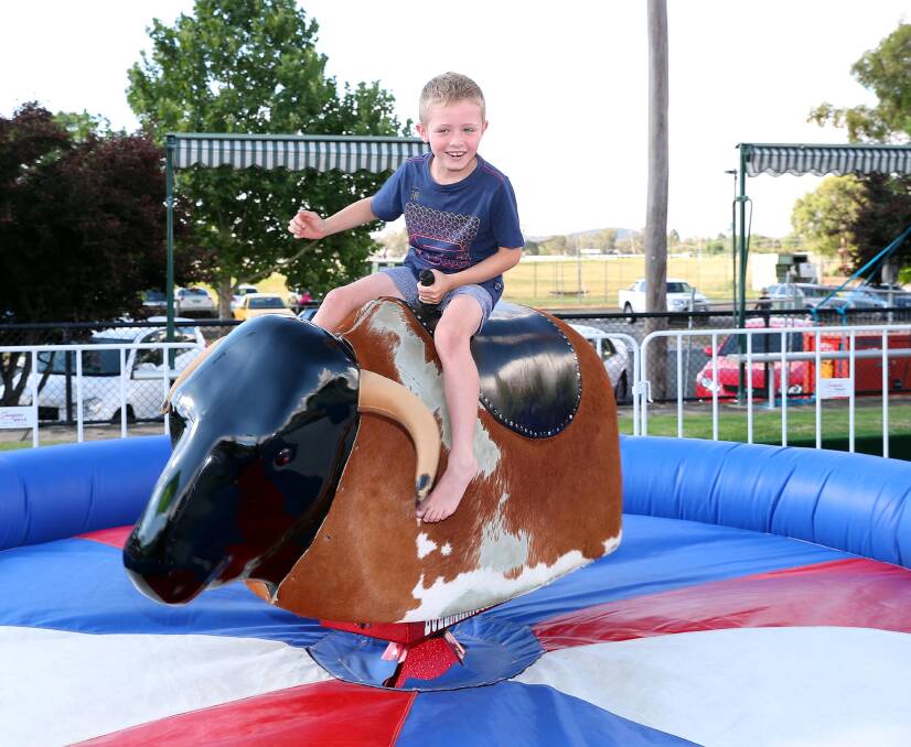 FUN TIMES: Hugo Varndell, 7, from Narrandera rides the mechanical bull at the Wagga RSL recently. Picture: Kieren L Tilly