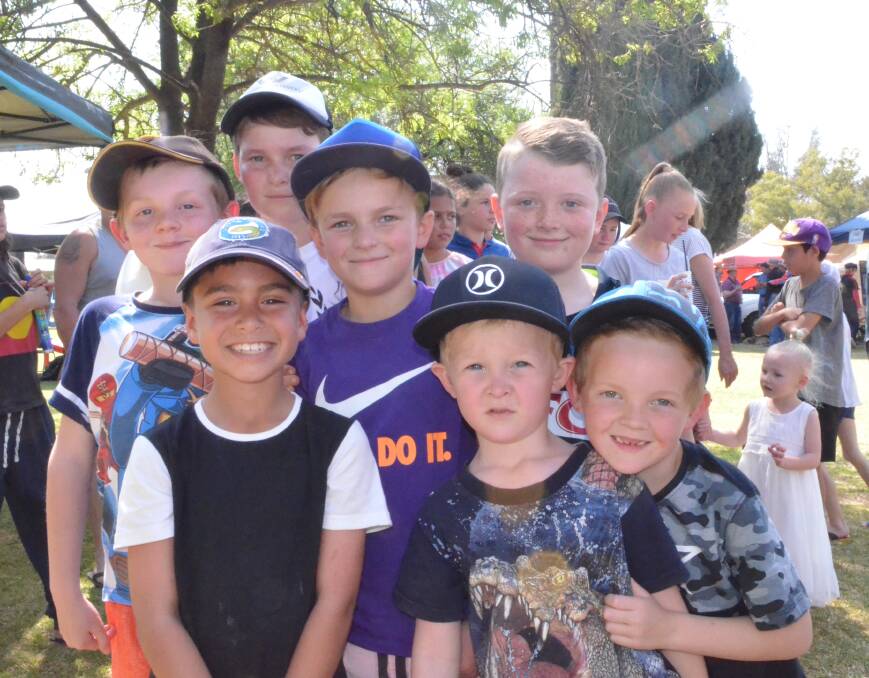 GOOD MATES: A group of young boys enjoy the day at the Darlington Point Spring Festival recently. Send your event details to rivcontributors@fairfaxmedia.com.au.