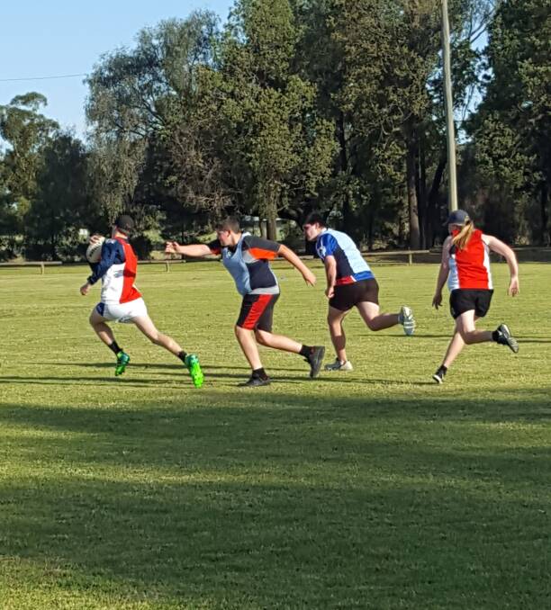 ALMOST: Harry Tooth gets past defender Thomas Scott during last week's junior Coleambally touch. Picture: Contributed