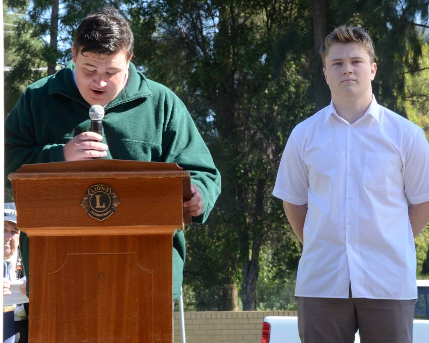 REMEMBER: Pat Bowditch and Michael Connor talking to the crowd on Anzac Day in Coly. 
Picture: Riley Krause.
