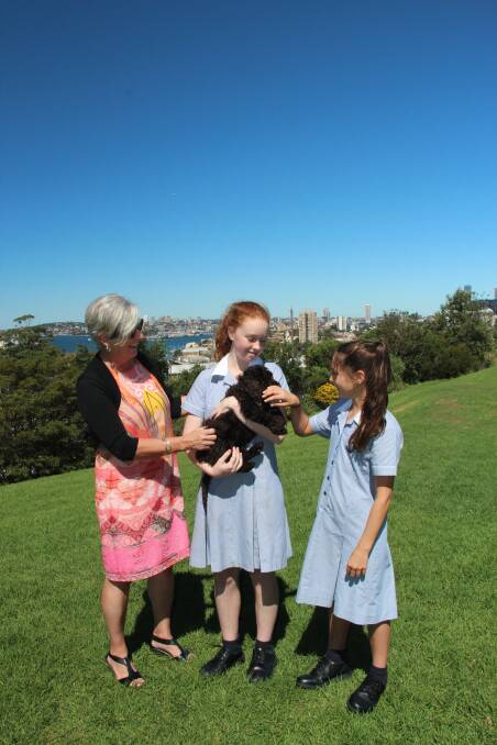 Wenona boarders with head of boarding Nonie Ayling and Dottie the Boarding House puppy.