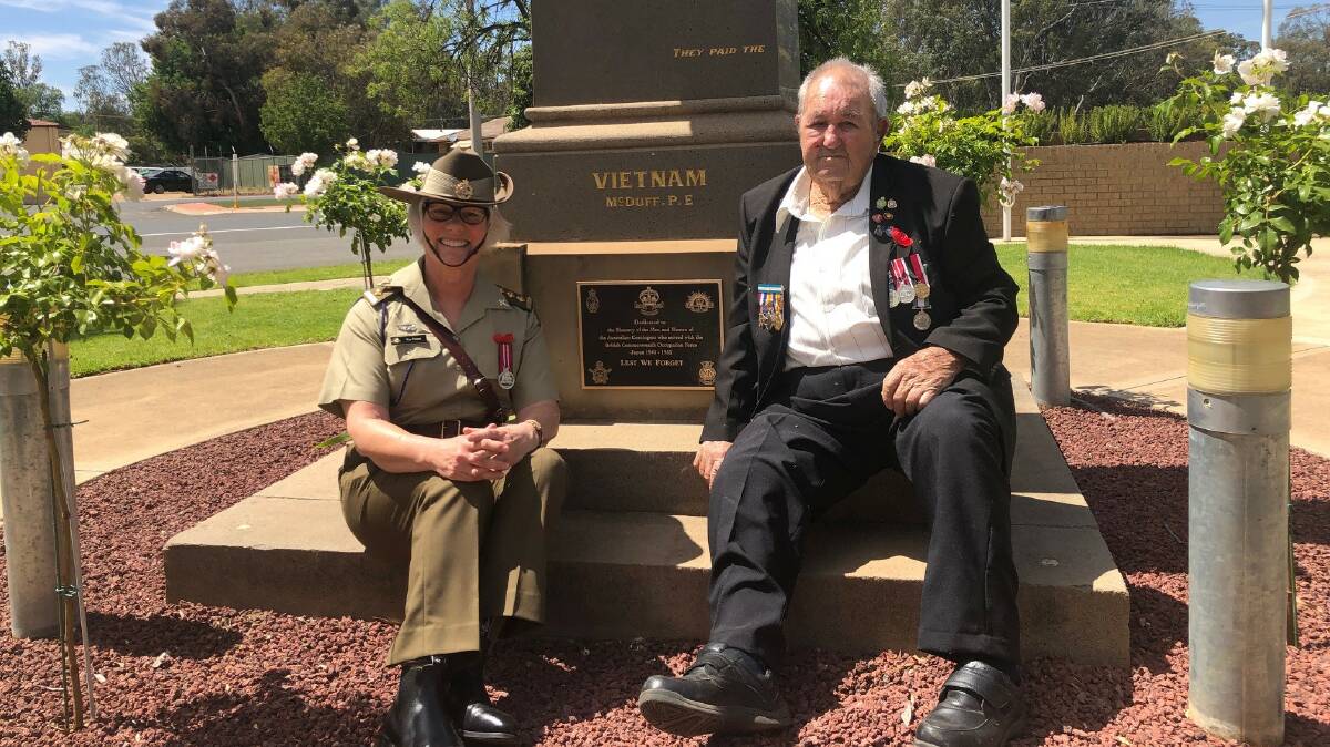 LEST WE FORGET: Reverend Fay Fraser and Bill Collins with the new plaque on the Darlington Point cenotaph. PHOTO: Murrumbidgee Council