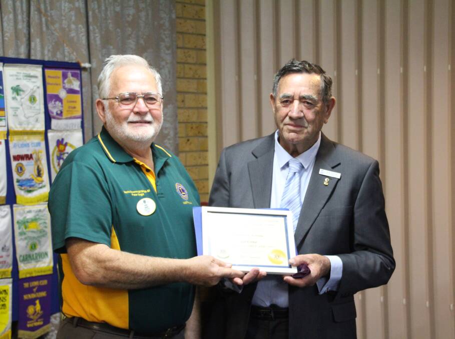 LIFE MEMBER: Lions Club District Governor Peter Bright awards life membership to Coleambally Lions Club member Ian Eddie. PHOTO: Contributed