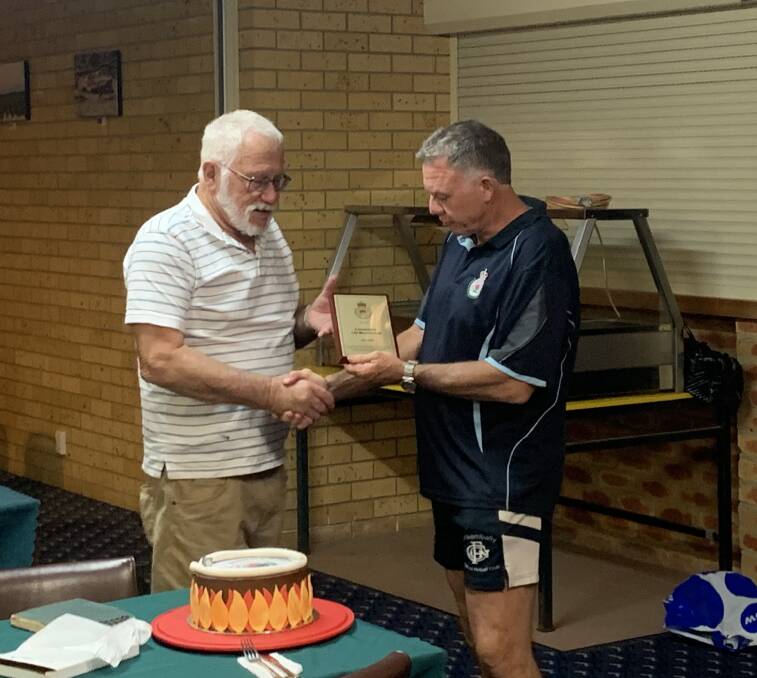 DEDICATED: John Smith is awarded a life membership award from Coleambally Rural Fire Service Captain Mick Breed for his 43 years of service to the brigade. PHOTO: Contributed