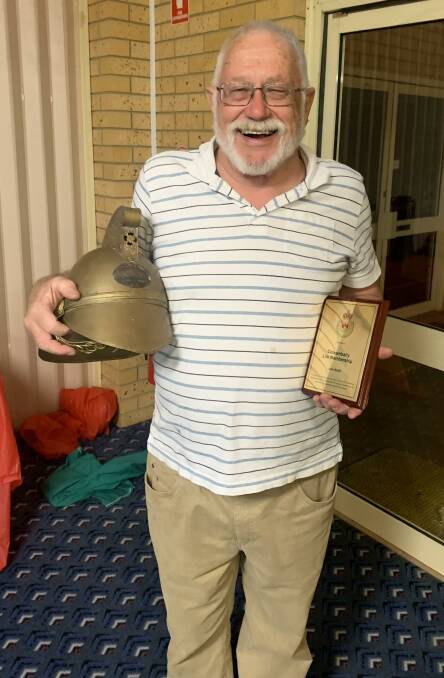 HONOURED: John Smith with his life membership award. PHOTO: Contibuted