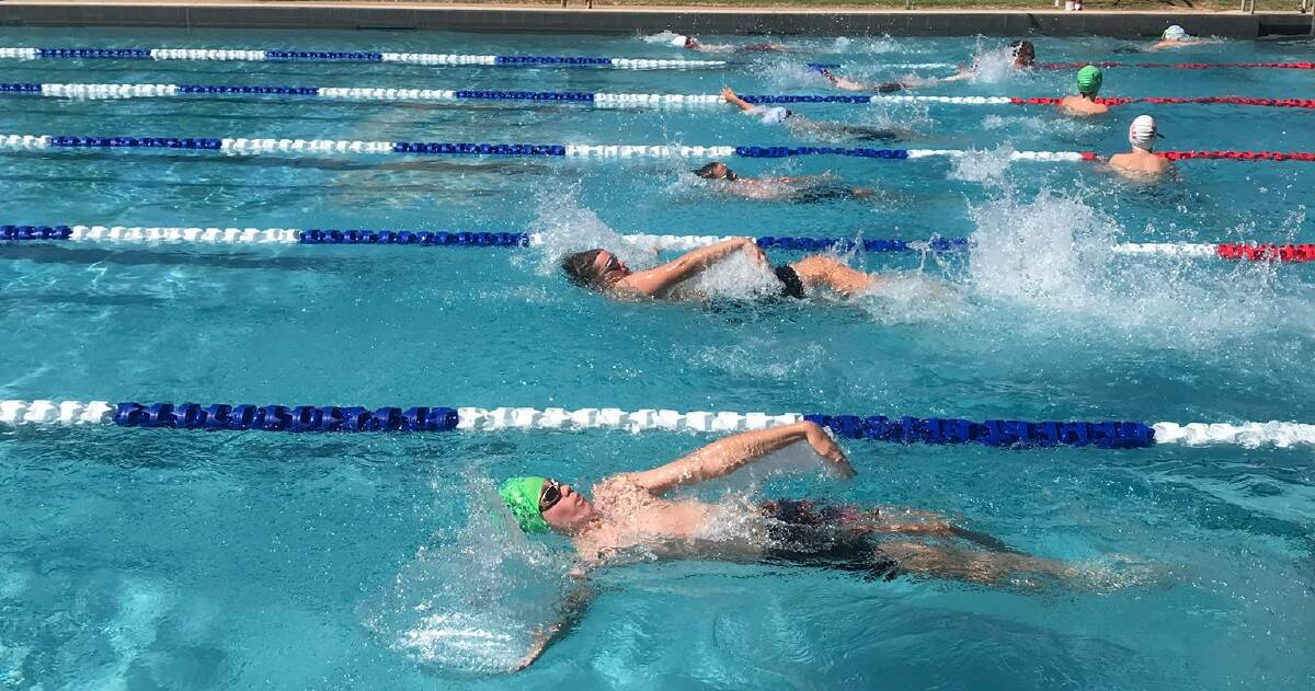 JUST KEEP SWIMMING: Swimmers go for top spot in a backstroke race at the Coleambally Community Pool. PHOTO: Contributed