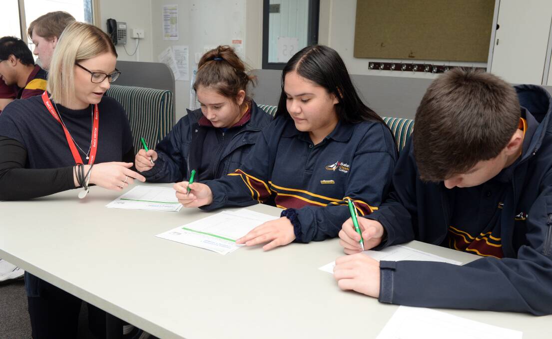 BUDGET: CAFS Love the Game gambling education program leader Tanika James with Ballarat Christian College students Krystal, Lydia and Ethan. Picture: Kate Healy