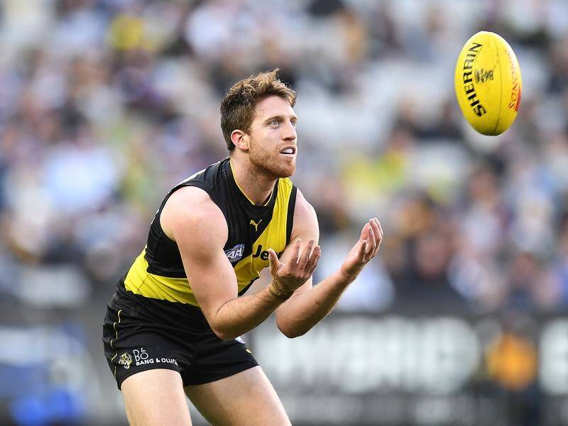 Reece Conca makes a surprise return from ankle issues when premiers Richmond take on Essendon.