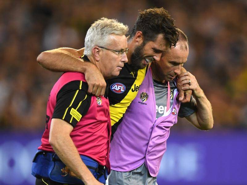 Richmond's Alex Rance was helped off in the 3rd quarter of his 200th match, having ruptured his ACL.