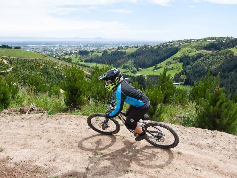 NZ's health minister has been rebuked for mountain-bike riding, at a time of hospital strain.