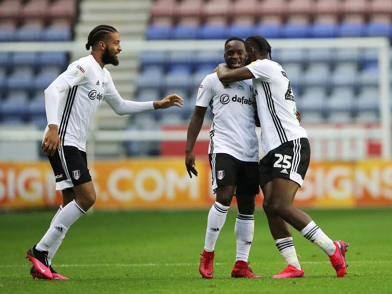 Fulham's Neeskens Kebano (c) and teammates celebrate his goal against Cardiff City.