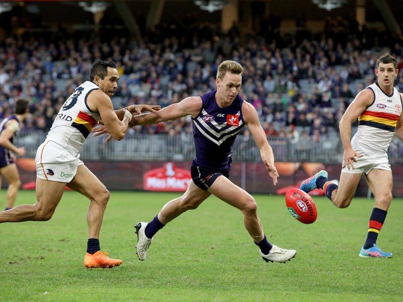 Ryan Nyhuis of the Dockers (centre) has been banned for three games.