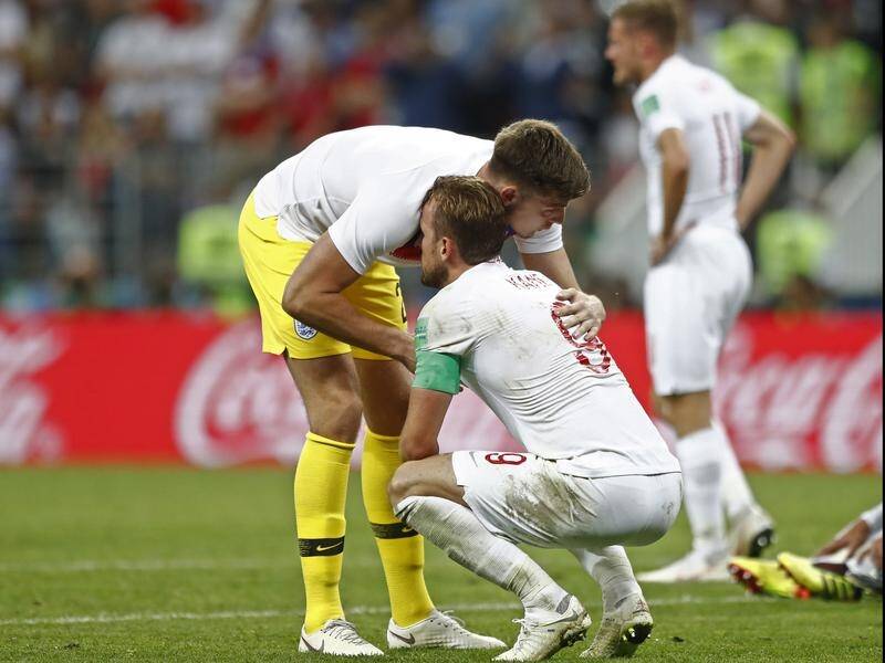 England reserve goalkeeper Nick Pope comforts his skipper Harry Kane after their semi-final loss.