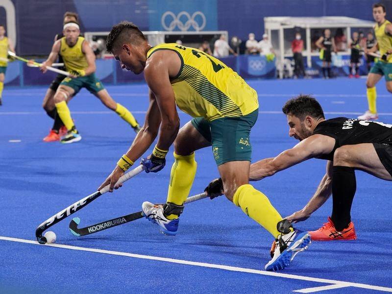 Tim Brand (c) was a key figure as the Kookaburras downed New Zealand to stay unbeaten at the Games.